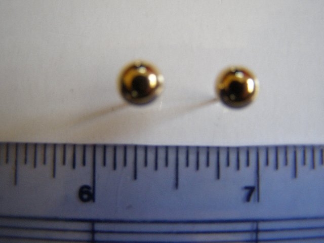 Preview of the first image of Gold stud type earrings.