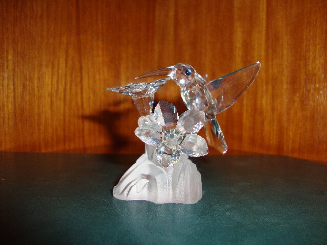 Preview of the first image of Swarovski crystal Hummingbird and flower.