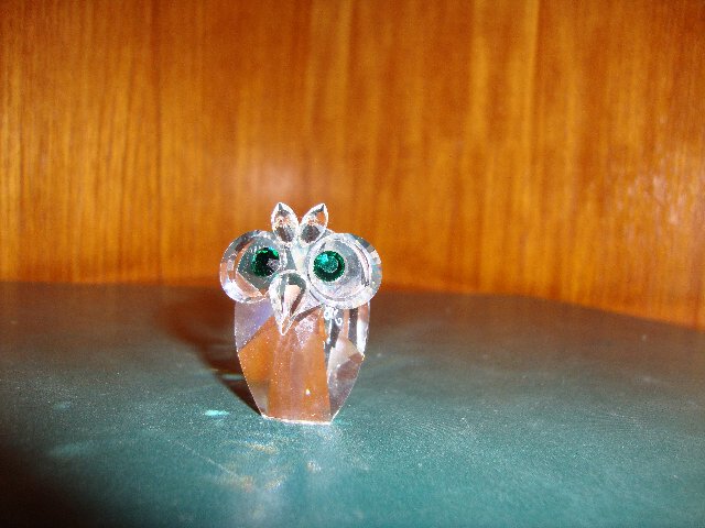 Preview of the first image of Swarovski owl with green eyes.