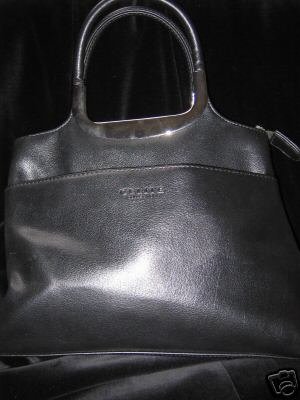 Preview of the first image of Superb Black Handbag,silver handles & details, 4 areas used.