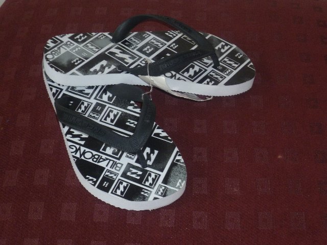 Preview of the first image of BLACK / WHITE FLIP FLOPS.