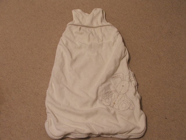 Preview of the first image of Mammas and pappas unisex cream sleeping bag.