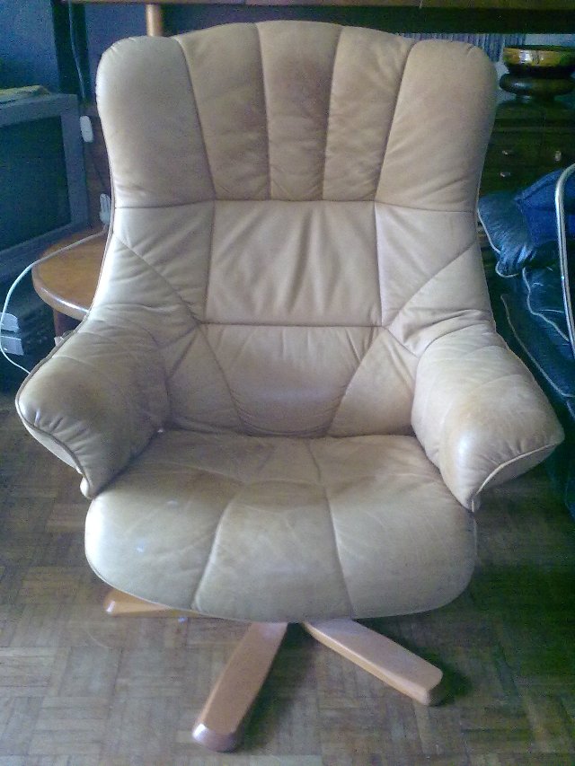 Preview of the first image of Quality reclining leather chair,needs some leather care..