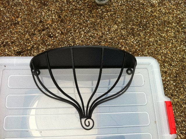 Preview of the first image of Set of 2 New Black Ornate plant pot/ wall shelves New.