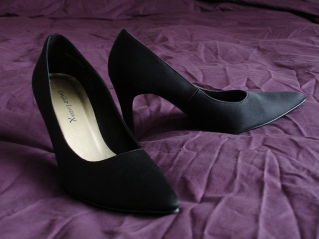 Preview of the first image of Black satin high heels.