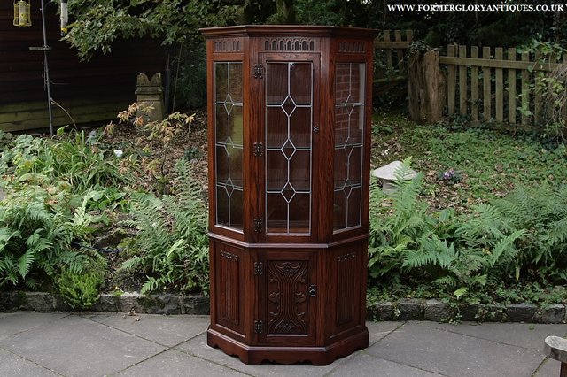 Preview of the first image of OLD CHARM TUDOR OAK CANTED DISPLAY CABINET DRESSER CUPBOARD.