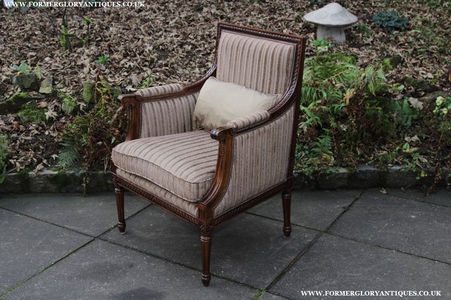 Preview of the first image of A FRENCH LOUIS MAHOGANY STYLE UPHOLSERED READING ARMCHAIR..