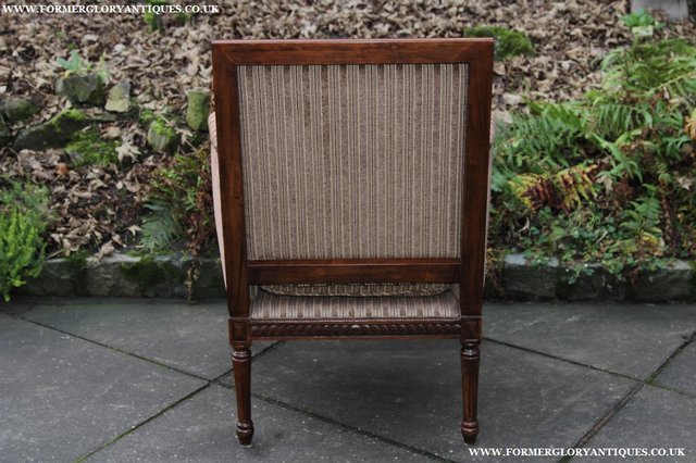 Image 9 of A FRENCH LOUIS MAHOGANY STYLE UPHOLSERED READING ARMCHAIR.