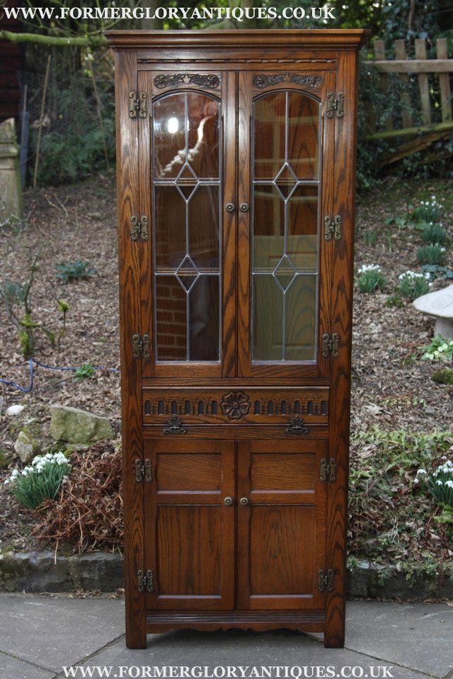 Preview of the first image of OLD CHARM LIGHT OAK CORNER CABINET DISPLAY CUPBOARD.