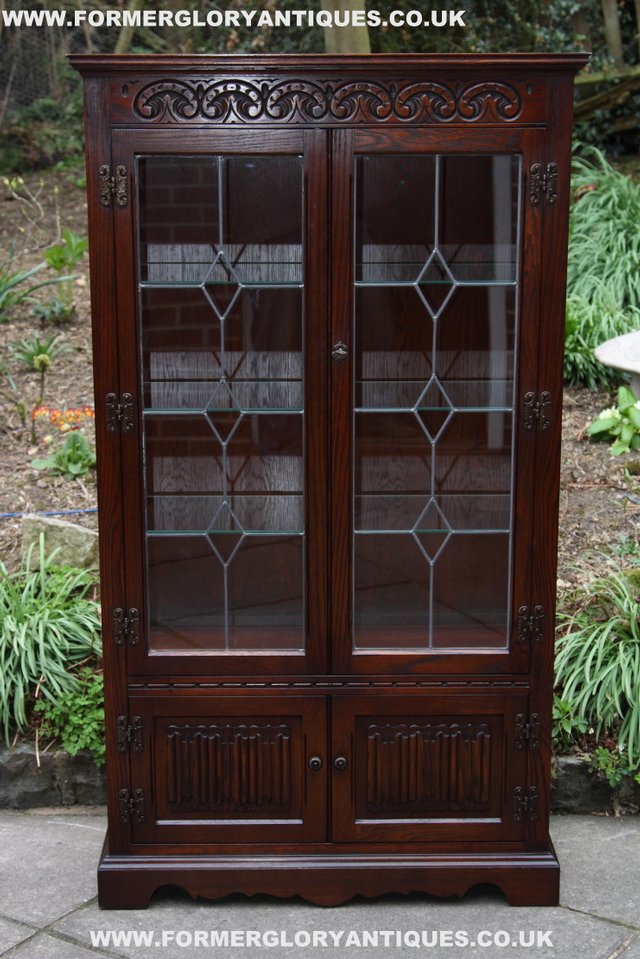 Preview of the first image of OLD CHARM WOOD BROS TUDOR OAK CHINA DISPLAY CABINET.