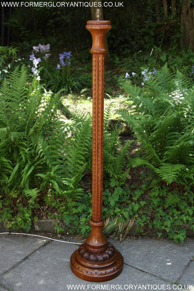 Preview of the first image of RUPERT NIGEL GRIFFITHS CARVED OAK STANDARD CHAIR LAMP.
