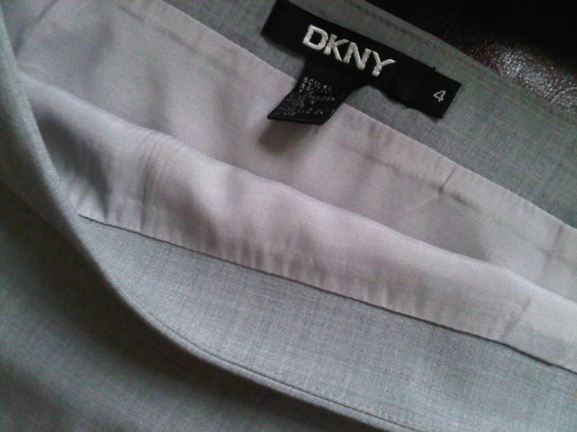 Preview of the first image of Designer DKNY grey skirt lined size US4, UK 6 - 8.