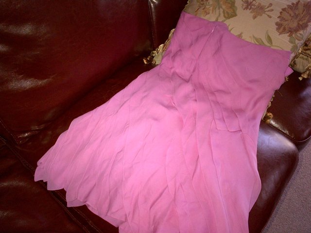 Preview of the first image of Cacharel pink silk skirt size 8-10 lined in silk frilled.