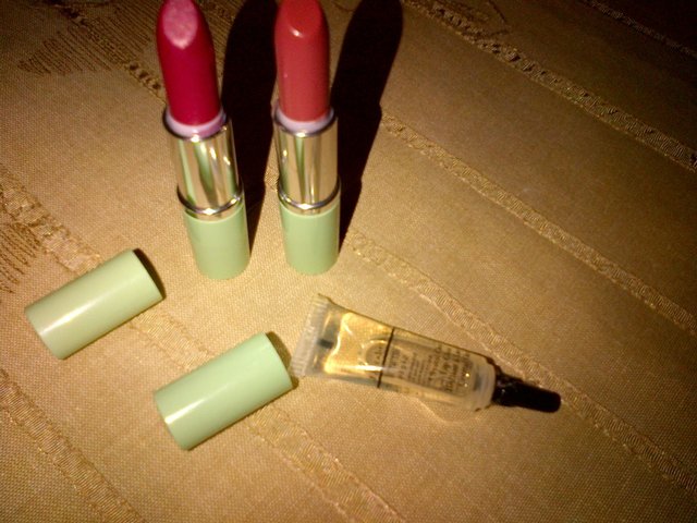 Preview of the first image of Two lipsticks and a lip gloss (Clinique).