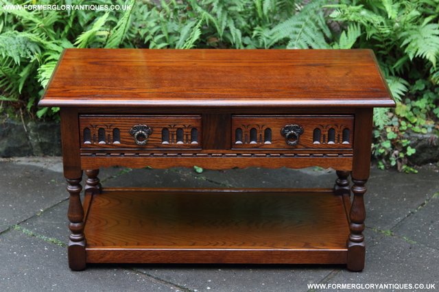 Preview of the first image of OLD CHARM JAYCEE TUDOR OAK TWO DRAWER LAMP HALL COFFEE TABLE.