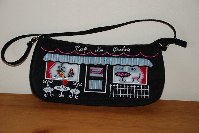 Preview of the first image of Small novelty black handbag.
