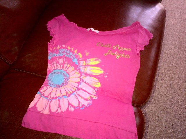 Preview of the first image of Chilli pepper pink t-shirt top blouse  UK size 10.