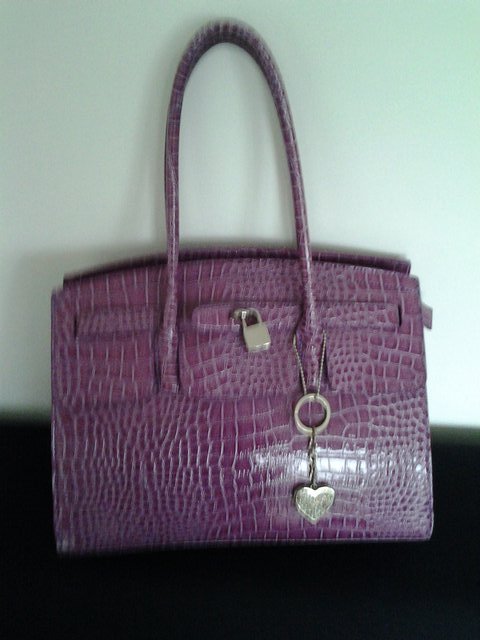 Preview of the first image of Pink Snakeskin Effect Bag.
