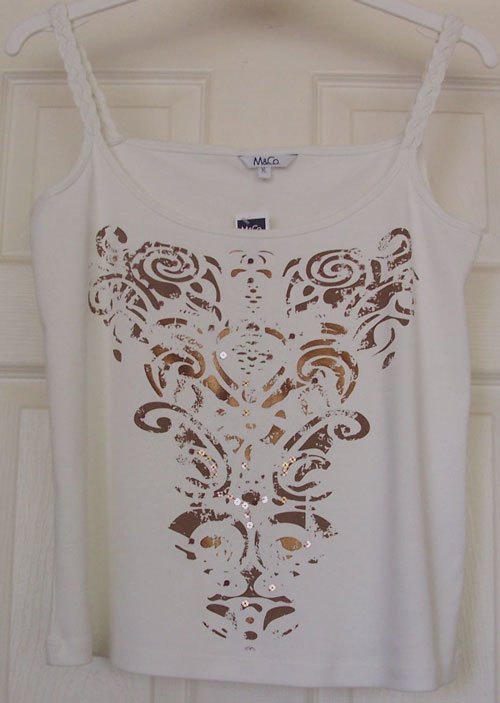 Preview of the first image of BNWT LADIES IVORY TOP WITH TRIBAL SPIRIT DESIGN - SZ XL.