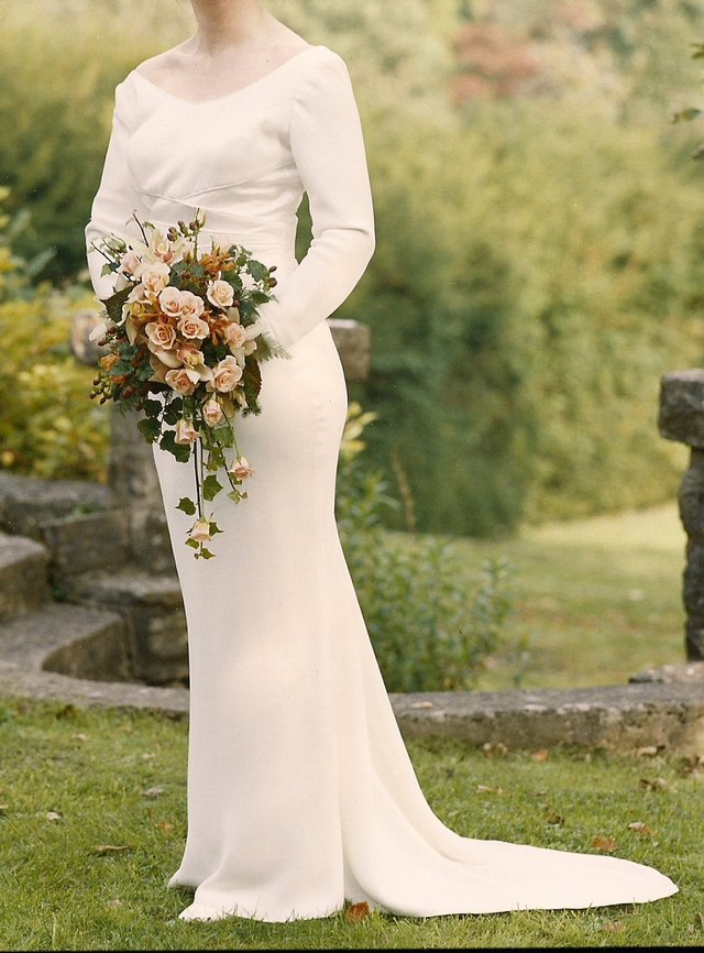 Preview of the first image of Suzanne Neville wedding dress - ivory column - size 14.