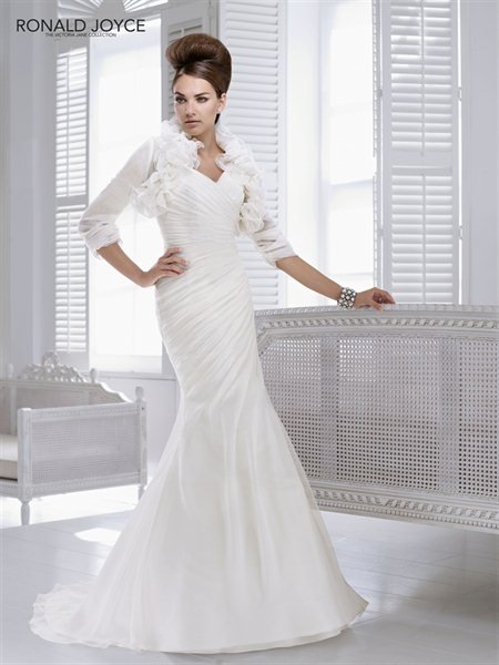 Preview of the first image of Ivory Wedding Dress by Ronald Joyce.