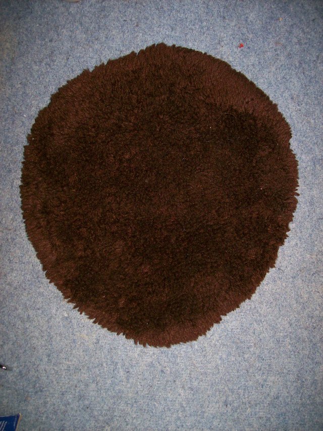 Preview of the first image of Brown Toilet Seat Cover - Used but in good condition..