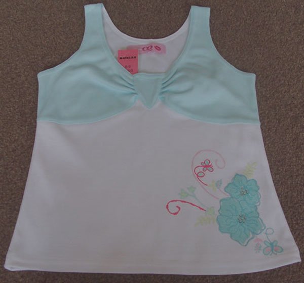 Preview of the first image of BNWT GIRLS VEST TOP WITH DIAMANTE FLOWERS AGE 8/9 YRS.