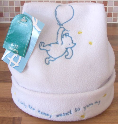 Preview of the first image of BNWT DISNEY WHITE WINNIE THE POOH FLEECE HAT AGE 6/12M.