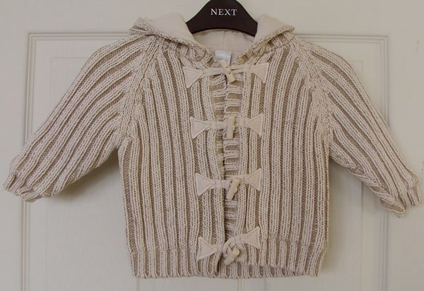 Preview of the first image of BABY BOYS FULLY LINED HOODED RIBBED CARDIGAN BY NEXT.