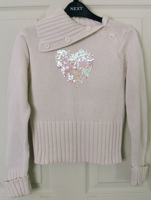 Preview of the first image of PRETTY GIRLS JUMPER WITH GLITTER HEART DETAIL - AGE 6-7 YRS.