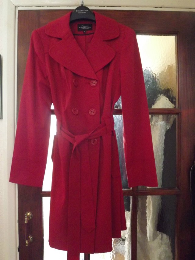 Preview of the first image of Ladies Red Raincoat.