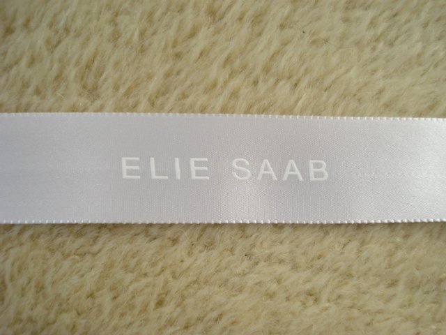 Preview of the first image of NEW GENUINE WHITE SATIN RIBBON BY FASHION DESIGNER ELIE SAAB.