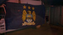 Preview of the first image of manchester city flag signed.