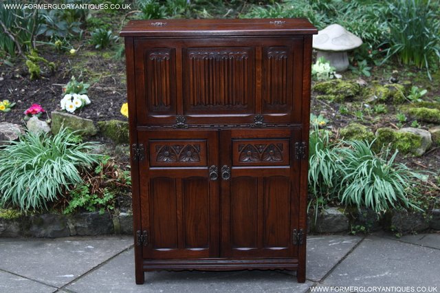 Preview of the first image of OLD CHARM TUDOR OAK WINE DRINKS CABINET CUPBOARD STAND.