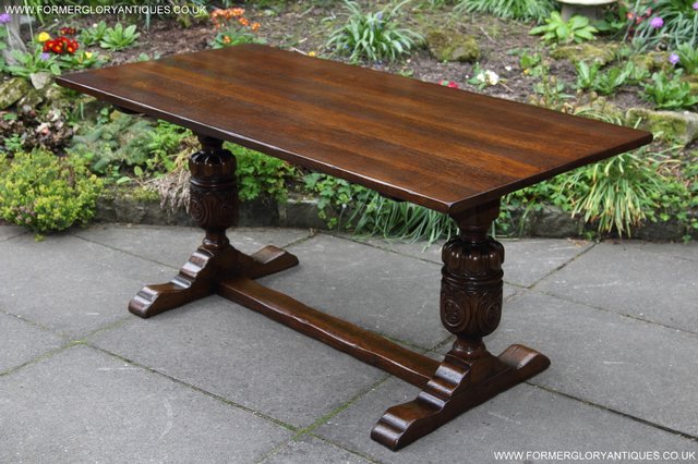 Preview of the first image of TITCHMARSH GOODWIN CARVED OAK REFECTORY TRESTLE DINING TABLE.