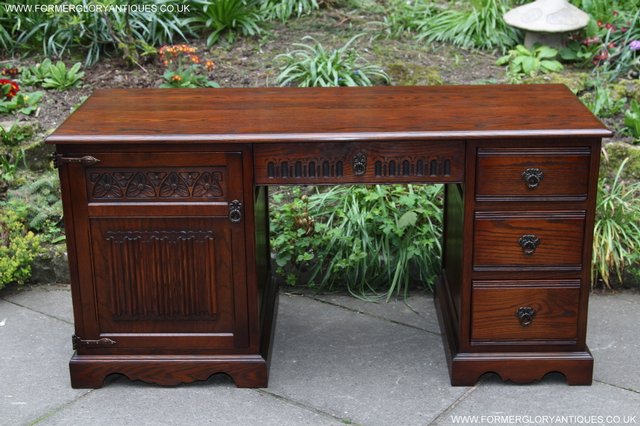 Preview of the first image of OLD CHARM TUDOR OAK COMPUTER WRITING DESK TABLE CABINET.