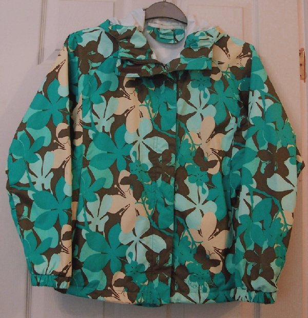 Preview of the first image of LADIES FLORAL SHOWERPROOF RAINCOAT BY TRESPASS - SZ S   B22.