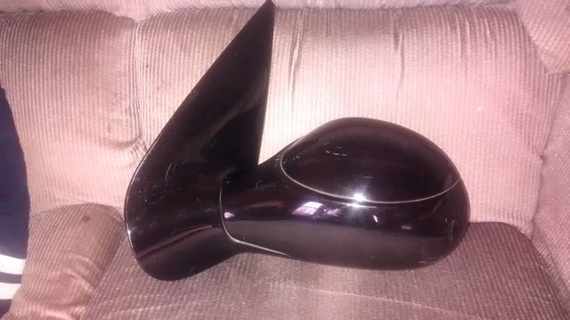 Preview of the first image of Peugeot 206 Nearside gloss black electric mirror.