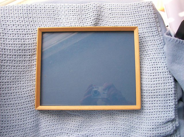 Preview of the first image of Wooden edged picture frame with glass approx 9.5" by 7.5".