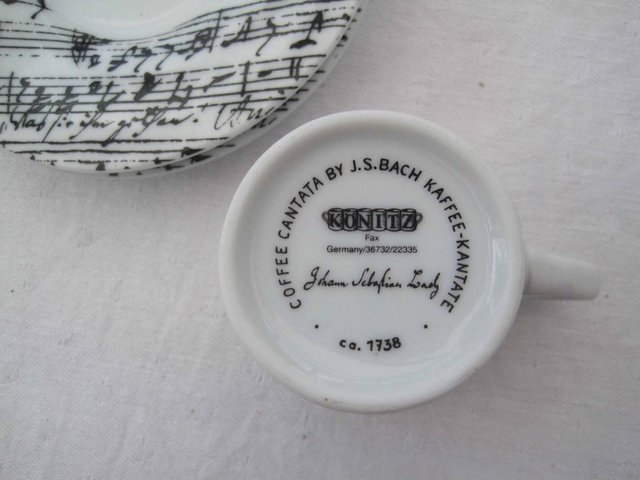 Image 2 of cup and 2 saucers with music pattern on