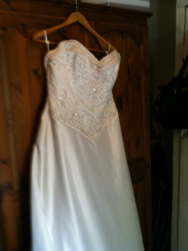 Preview of the first image of beautiful....brand...new... wedding.. dress .size .14.