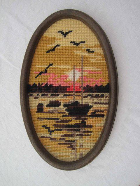 Preview of the first image of tapestry sewn picture of a boat at sunset in wool.