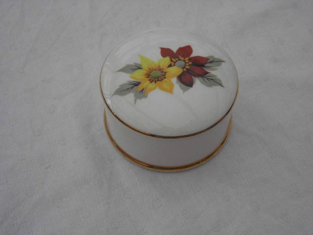 Preview of the first image of round china box with lid.