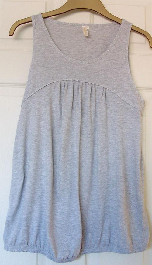 Preview of the first image of LADIES SLEEVELESS GREY TOP BY MISS FIORI - SZ 18 B5.