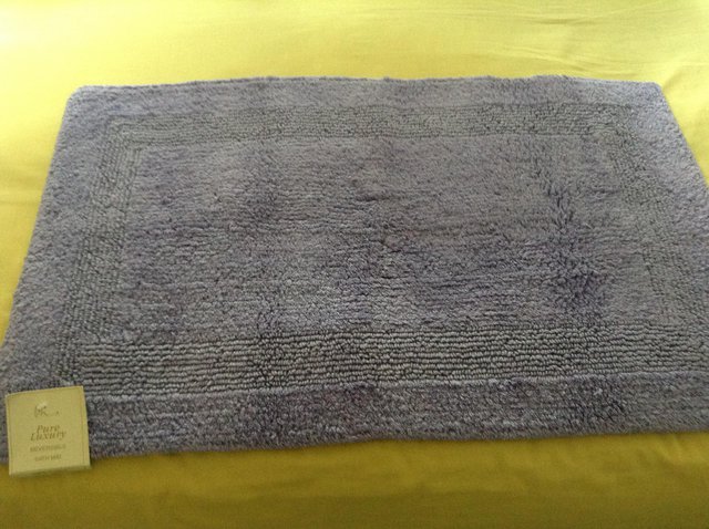 Preview of the first image of New 100% Cotton Reversible Bath Mat - 31" x 20".
