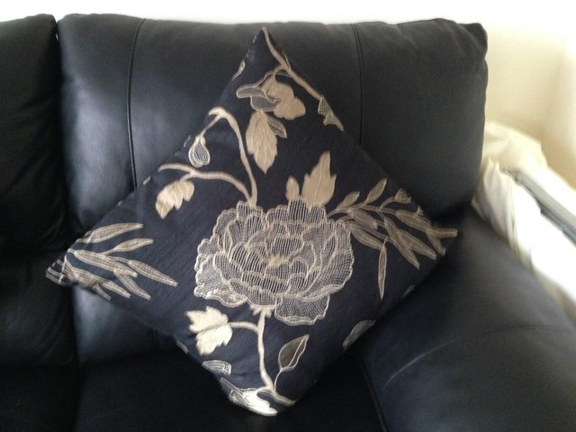 Preview of the first image of M&S black and bronze cushions x 4.