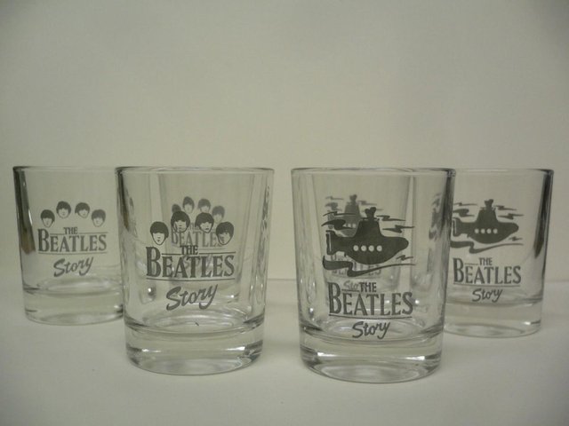 Preview of the first image of Set of 8 Beatles Story Shot Glasses.