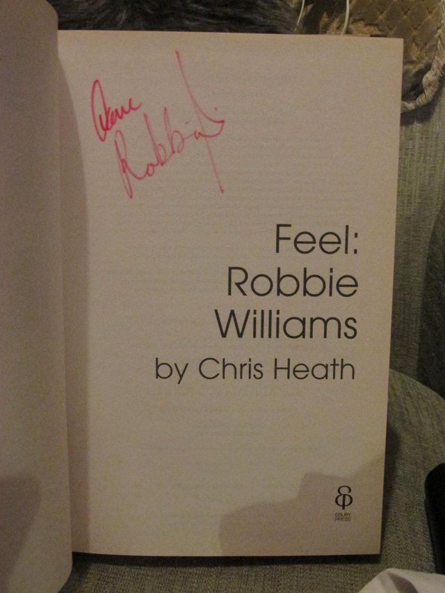 Preview of the first image of ROBBIE WILLIAMS HAND SIGNED BOOK.