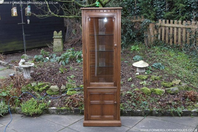 Preview of the first image of ERCOL GOLDEN DAWN CORNER DISPLAY CABINET CUPBOARD STAND.