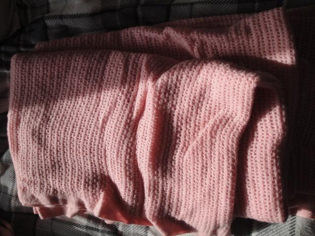 Preview of the first image of Pink cellular blanket material approx 9' length.